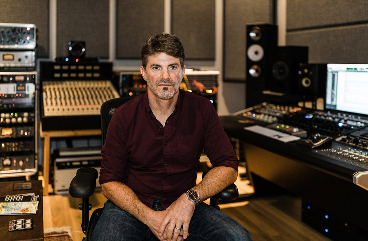 Producer Jacquire King at the console in his studio